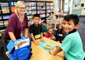 Mrs. Day and her students designing model home from the Three Little Pigs