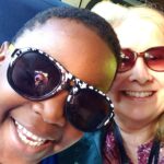 Student and teacher riding the bus