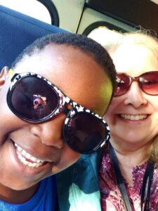 Student and teacher riding the bus