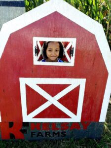 girl with a red barn
