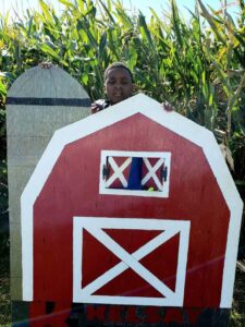 boy with a red barn