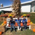 sitting on the bench at the farm