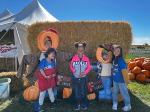 Students with pumpkins at the farm