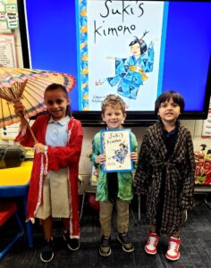 first grade students trying on Japanese Kimonos