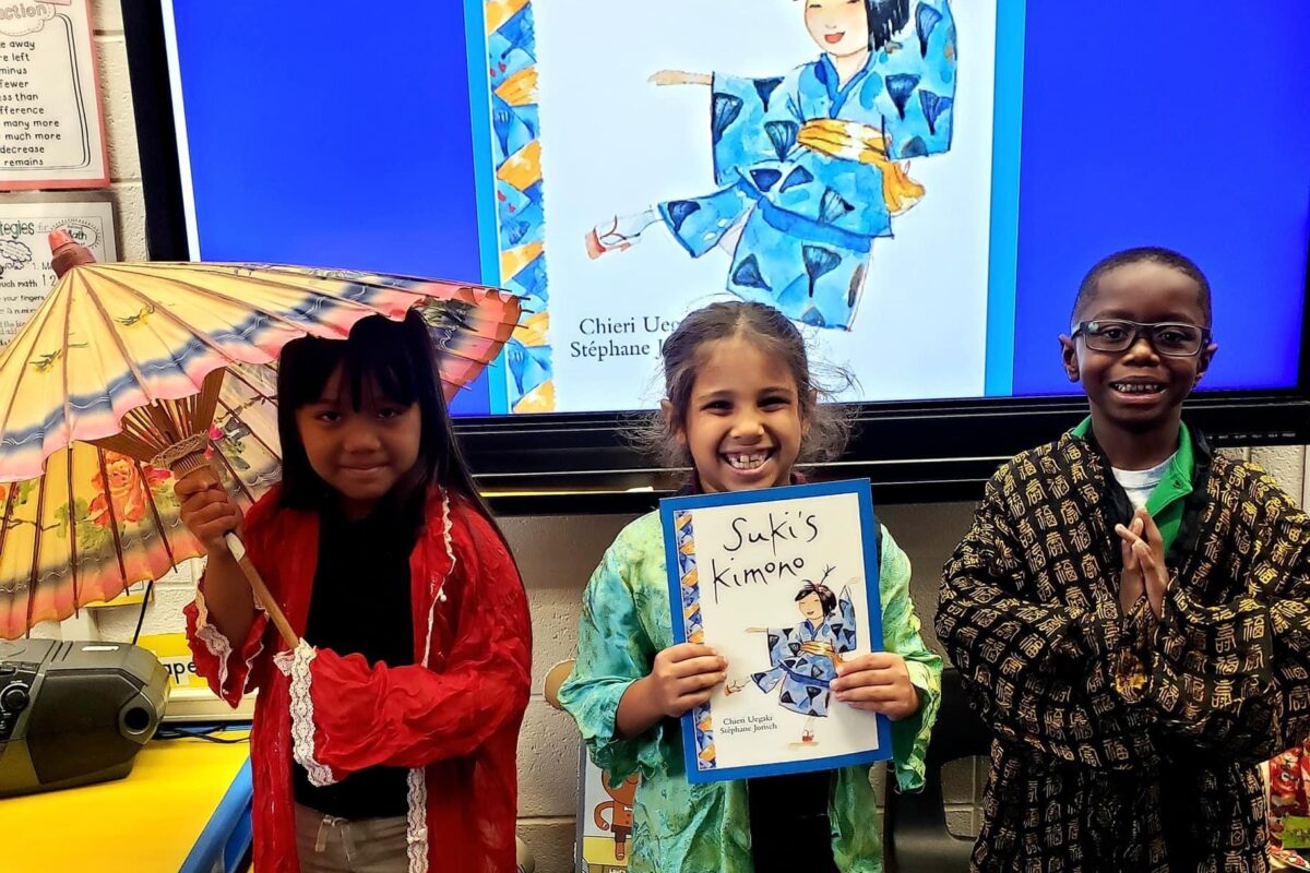 first grade students trying on Japanese Kimonos
