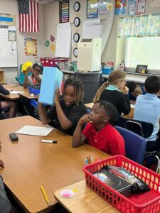 5th grade students working in small groups