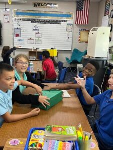 5th grade students working in small groups