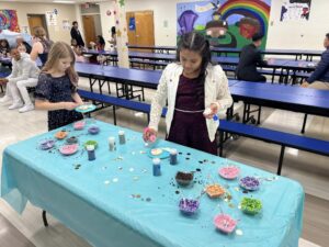 girls decorating cookies at the father-daughter dance