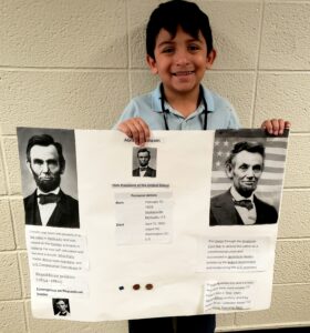 1st grader presenting their famous American project