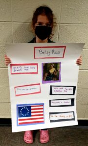 1st grader presenting their famous American project