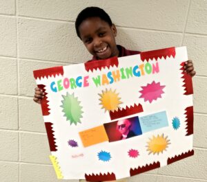 1st grader presenting their famous American project
