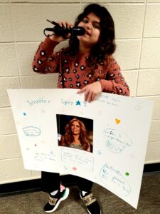 1st grader presenting their famous American project
