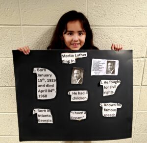 1st grader presenting their famous American project