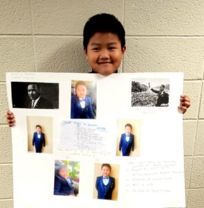 1st grader presenting their famous American project