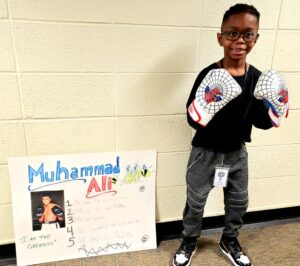 1st grader presenting their famous American project