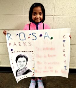 1st grader presenting their famous American project