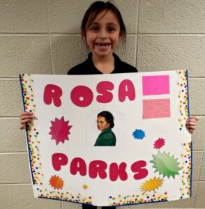 1st grader presenting their famous American project