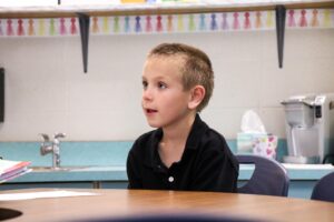 first grade student interviewing for a class job