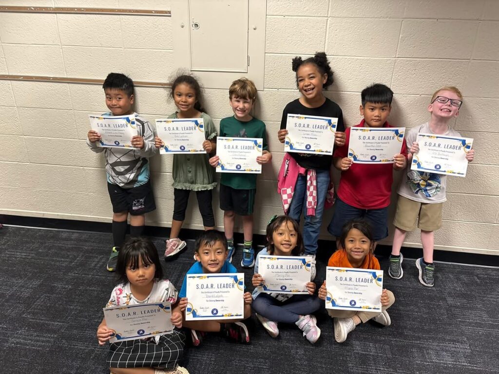 Glenns Valley students holding their Ownership Award