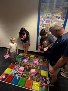 Family playing Giant Candy Land