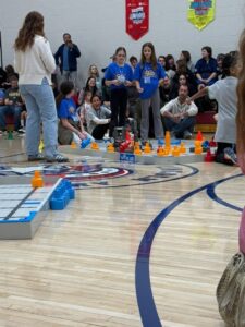 students working on teamwork at the robotics competition