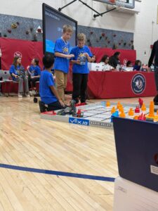 students working on teamwork at the robotics competition