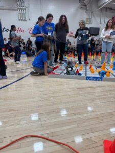 students working on teamwork at the robotics competition