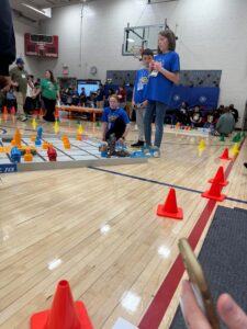 students working on teamwork at the robotics competition