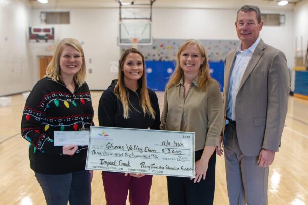 Mrs. Smith and Mrs. Stump accepting the Grant from Mrs. May and Dr. Spray