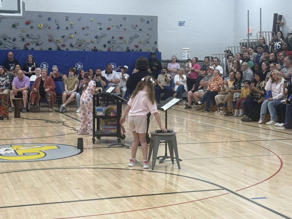 2nd grade students singing and dancing