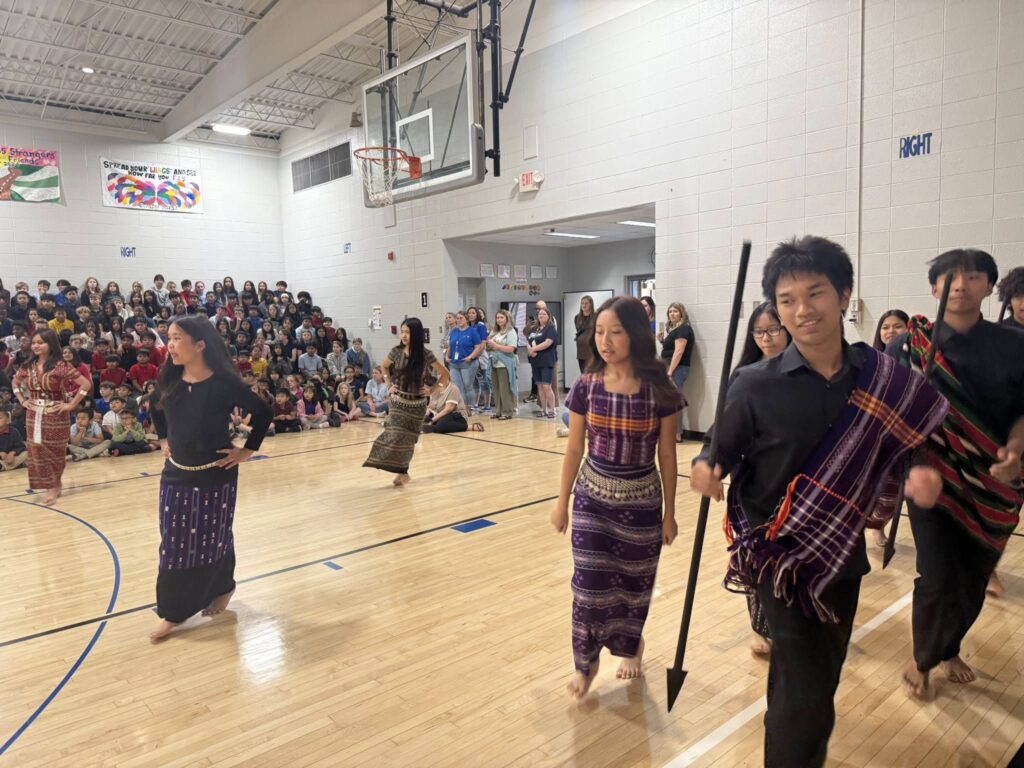 Photo Perry Meridian High School students perform a traditional Chin dance for Glenns Valley students
