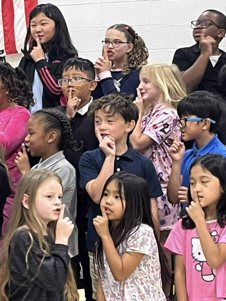 2nd grade students singing "Marching Orders"