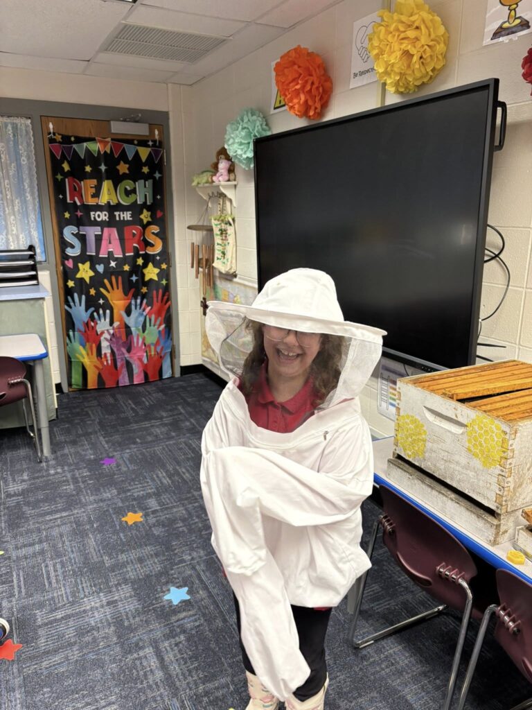 second grader wearing a bee keeper suit