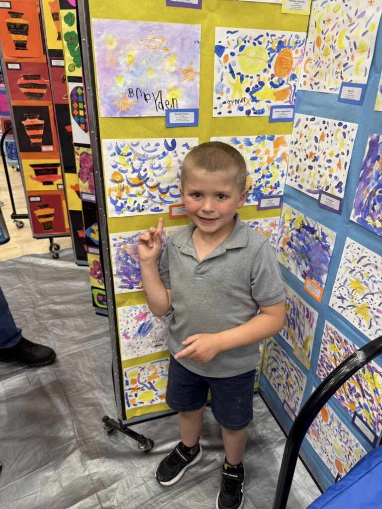 Student with their Starry Night Painting