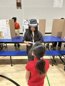 Student dressed as Michael Jackson and presenting at the wax museum