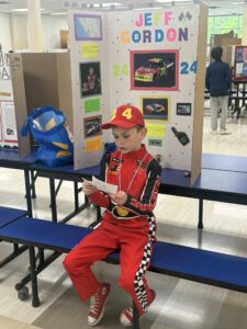 Student dressed as Jeff Gordon and presenting at the wax museum