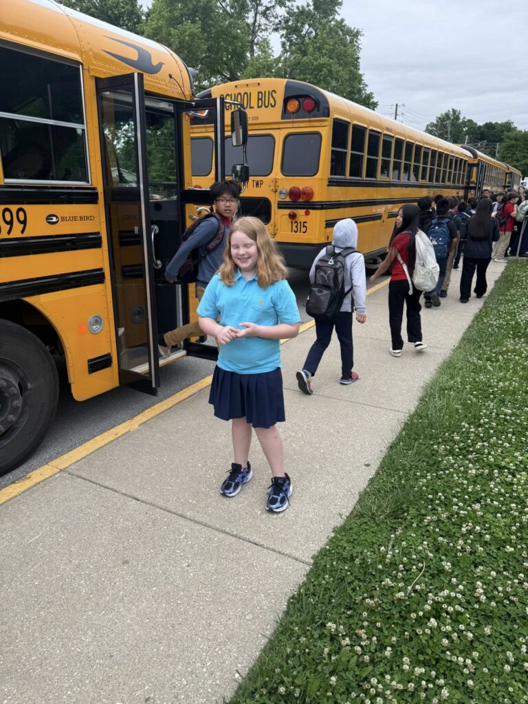 Delilah welcoming students to school