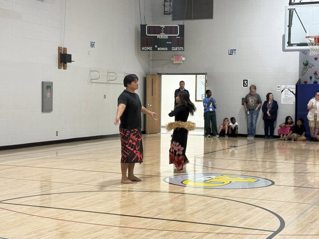 Photo Perry Meridian High School students perform a traditional Polynesian dance for Glenns Valley students