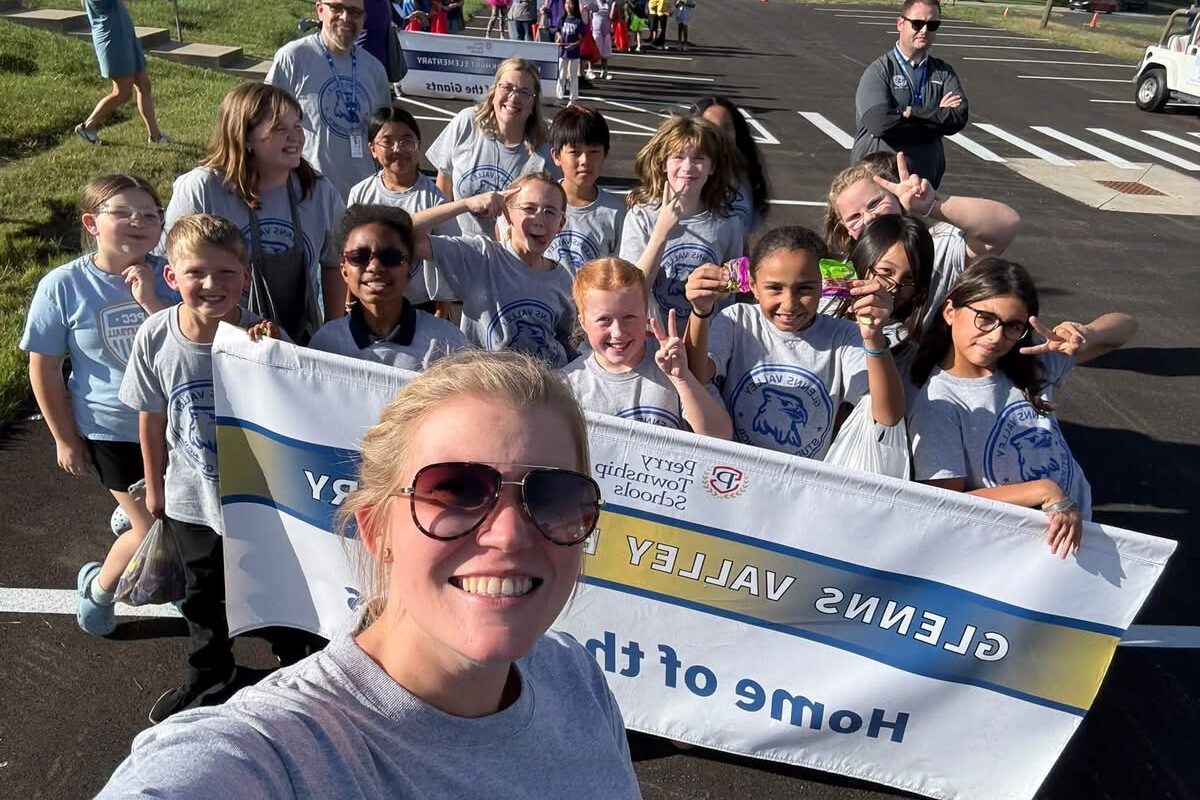 a photo of Mrs. Smith with the Glenns Valley Student council at the Homecoming Parade.