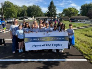a photo of the Glenns Valley student council marching in the Homecoming Parade