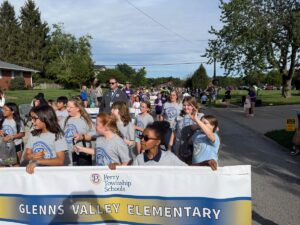 a photo of the Glenns Valley student council marching in the Homecoming Parade
