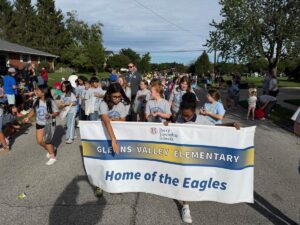 a photo of the Glenns Valley student council marching in the Homecoming Parade