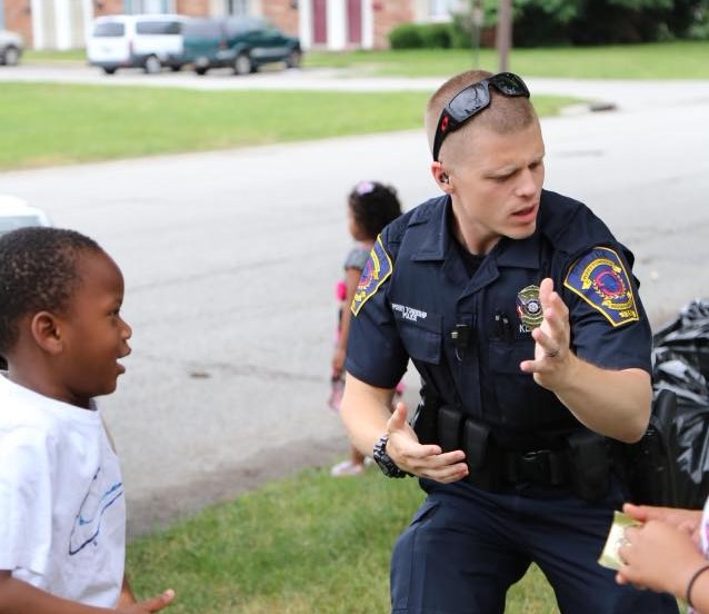 Officer Klein Dancing with Child