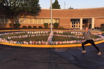 Sara Orme Hughes Standing outside Clinton Young Elementary