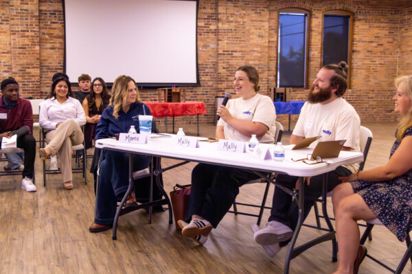 Judges giving feedback to students