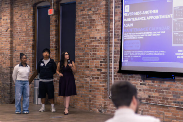Students presenting their pitch to Keep Rolling, stakeholders, leadership, and judges.