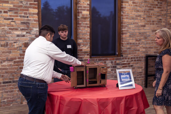 students meeting with business owners