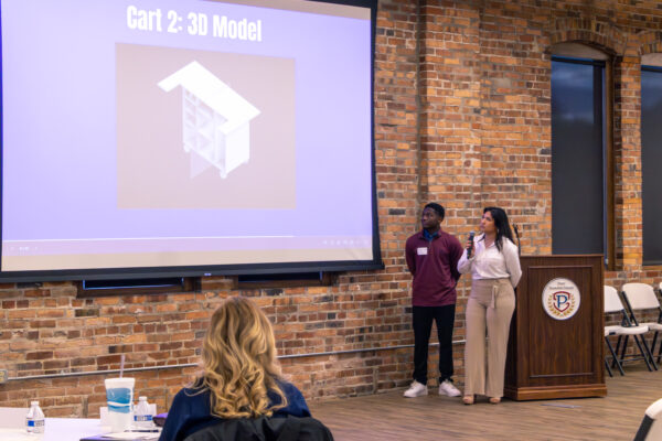 Students showing prototypes to stakeholders